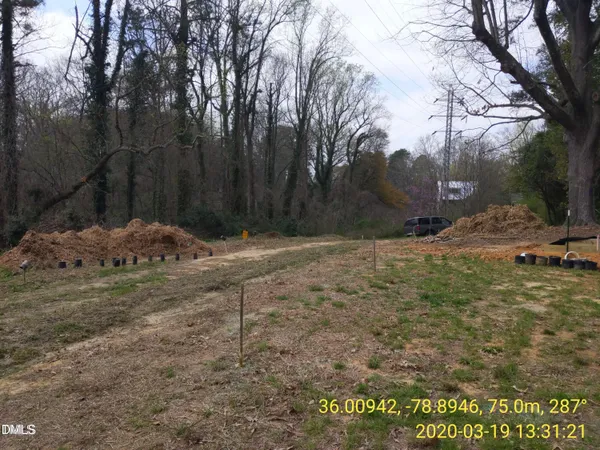 a backyard of a house with large trees