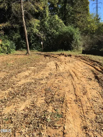 a view of a yard covered with snow in front of house