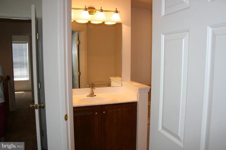 1317 Steed Street Ranson, WV 25438 - Photo 6 of 8 a bathroom with a sink and a mirror