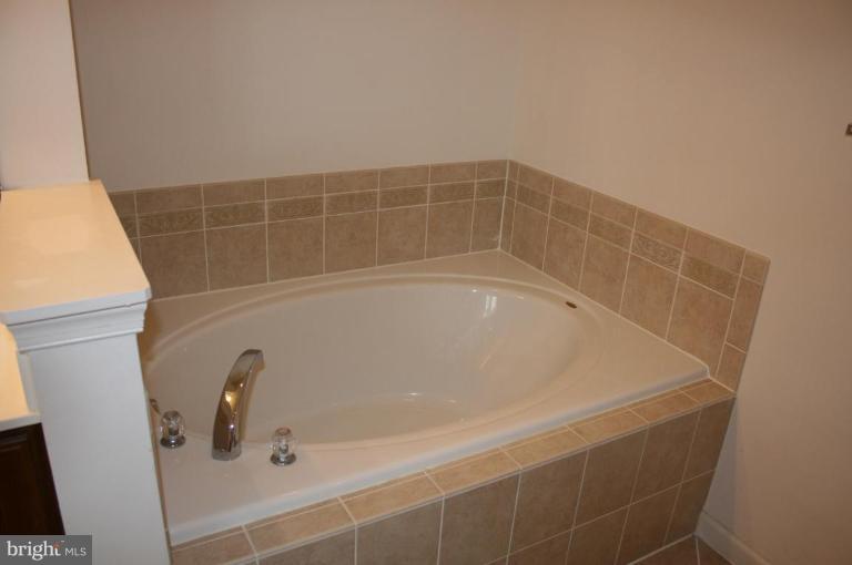 1317 Steed Street Ranson, WV 25438 - Photo 7 of 8 a close up of a bathtub