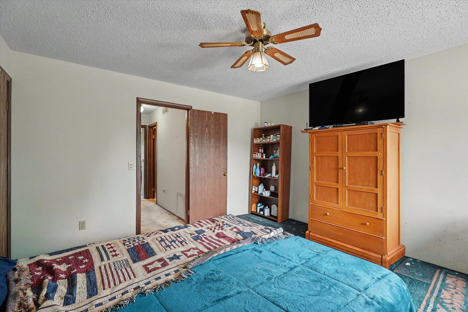 711 Higgins Road Champaign, IL 61822 - Photo 17 of 23 a bedroom with a bed and a flat screen tv