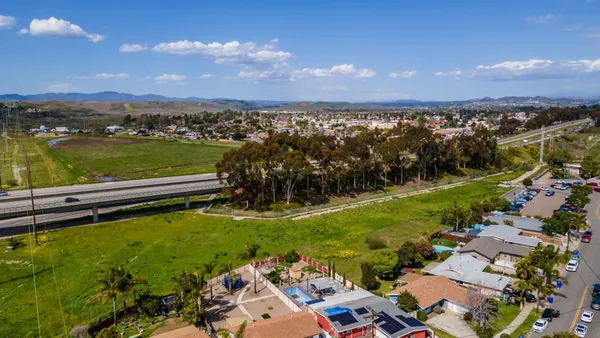 a view of a city with a lake