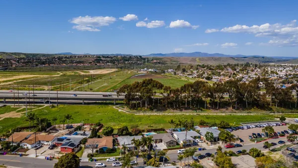 an aerial view of residential houses with outdoor space