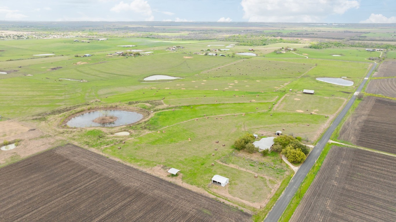 19810 Janak Road Coupland, TX 78615 - Photo 2 of 14 a bathroom with a sink and bathtub