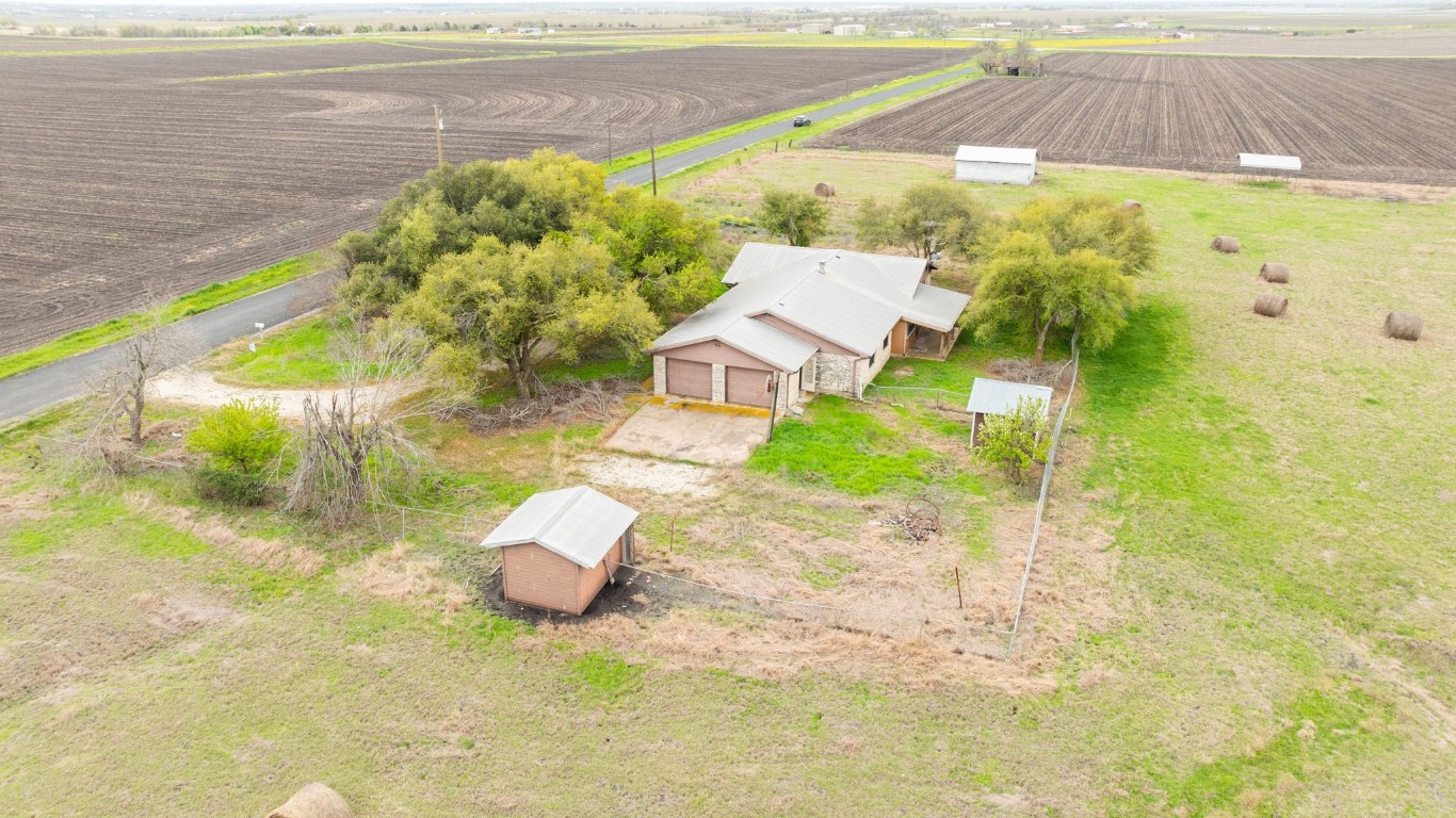 19810 Janak Road Coupland, TX 78615 - Photo 9 of 14 a aerial view of a house with a yard and ocean view