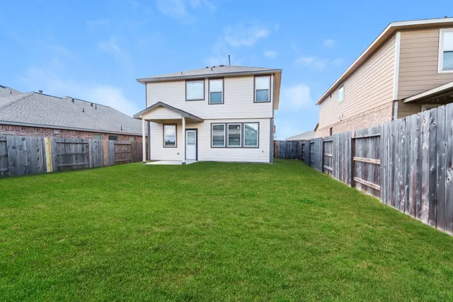a front view of a house with a yard and porch