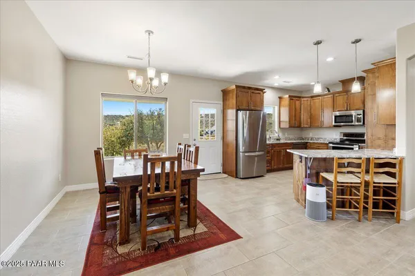 a view of a dining room with furniture window and outside view