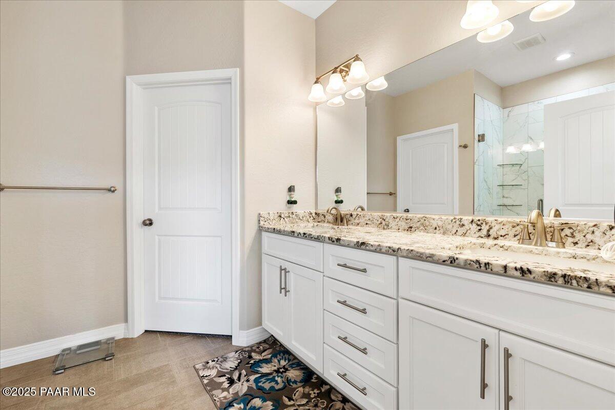 12376 East Prescott Dells Road Dewey-Humboldt, AZ 86327 - Photo 19 of 30 a bathroom with a sink and a mirror