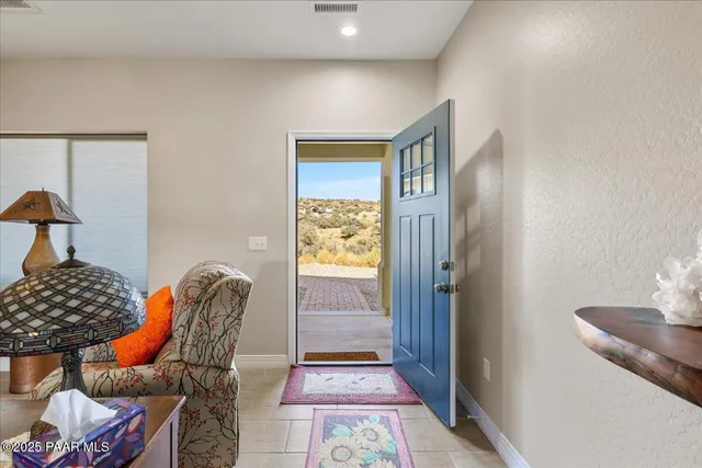 a bedroom with furniture and a window