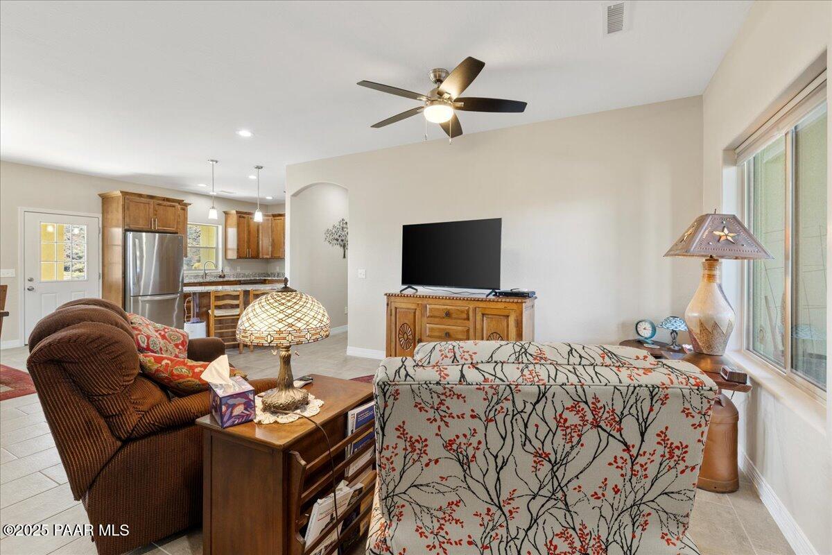 12376 East Prescott Dells Road Dewey-Humboldt, AZ 86327 - Photo 5 of 30 a living room with furniture and a flat screen tv