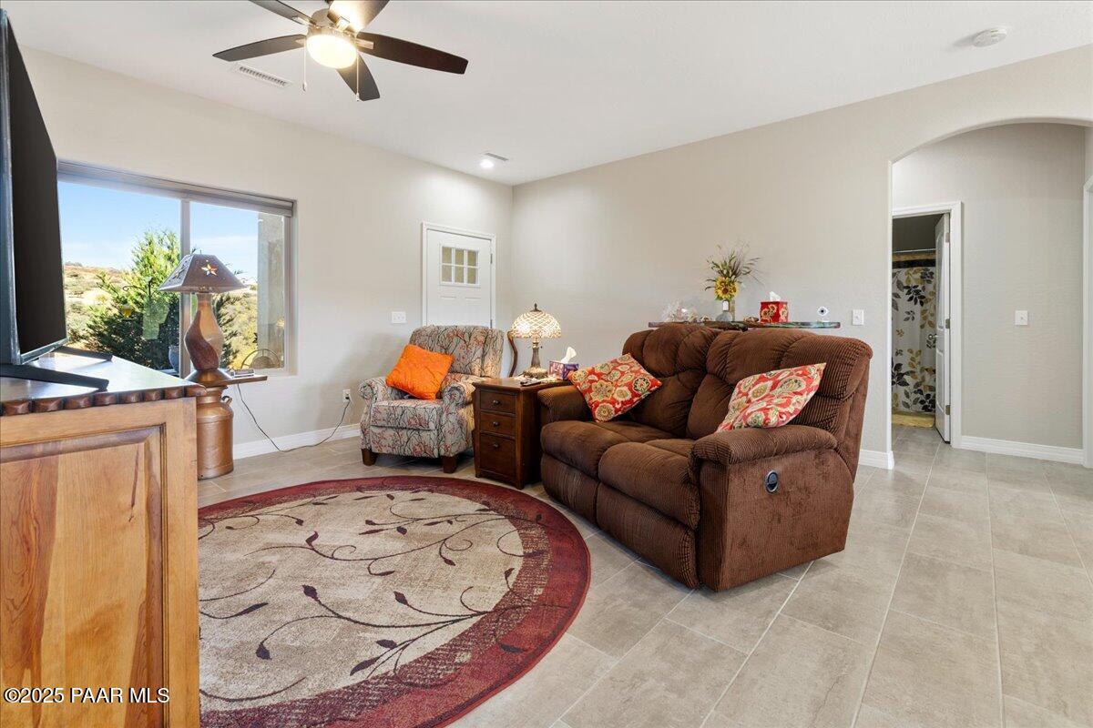 12376 East Prescott Dells Road Dewey-Humboldt, AZ 86327 - Photo 8 of 30 a living room with furniture and a flat screen tv