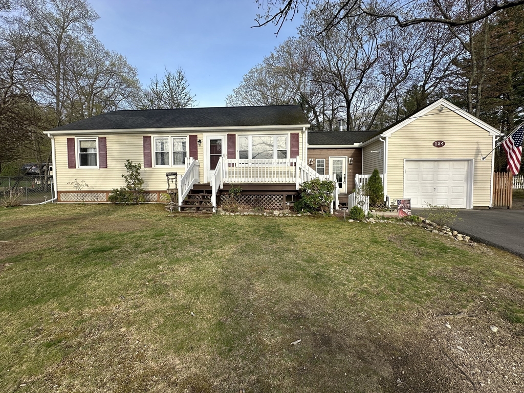 124 Cooper Road Northbridge, MA 01534 - Photo 1 of 25 a front view of house with yard and trees in the background