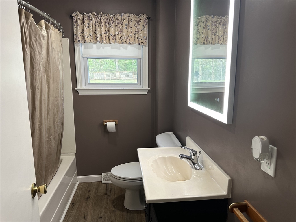124 Cooper Road Northbridge, MA 01534 - Photo 12 of 25 a bathroom with a sink toilet and a window