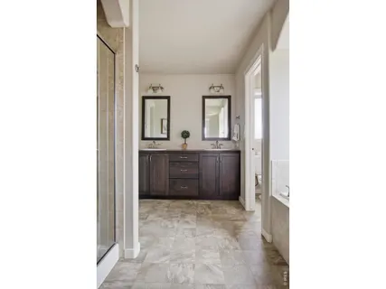 a view of a bathroom with sink and mirror