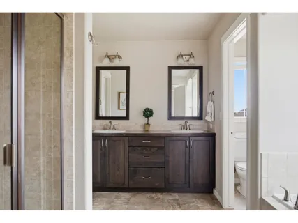 a bathroom with mirror and sink