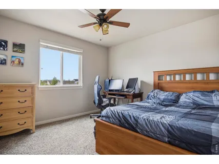 a bedroom with furniture and a window