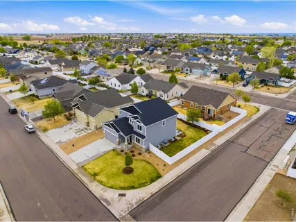 an aerial view of residential houses with outdoor space