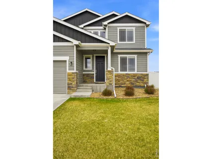 a view of a house with wooden floor and a yard