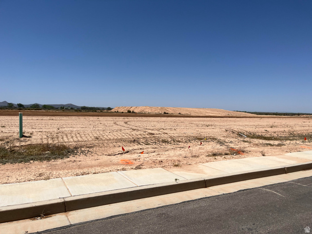 5119 North 75 East, Unit 208 Enoch, UT 84721 - Photo 5 of 14 Expansive, level lot with clear skies, offering a substantial building area