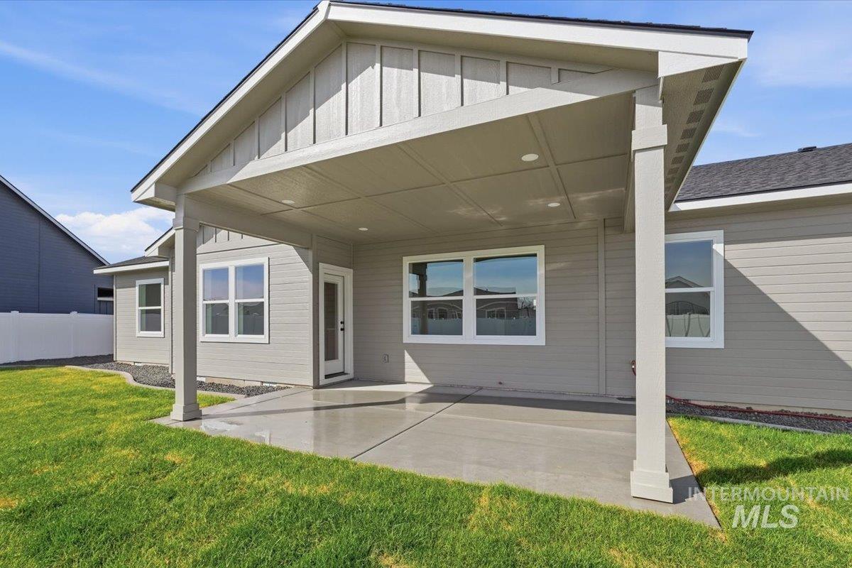 2175 Austin Way Fruitland, ID 83619 - Photo 28 of 30 Back of house featuring a patio area and board and batten siding