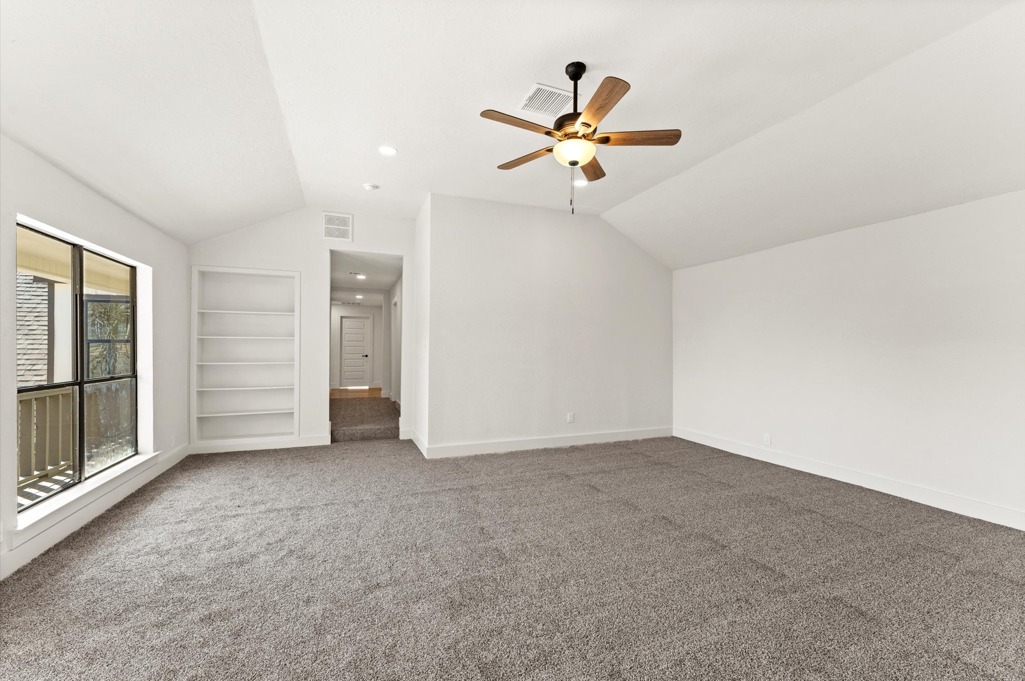 3725 Griggs Road Houston, TX 77021 - Photo 29 of 37 There is tons of natural light and built-in bookcases in this upstairs living space.