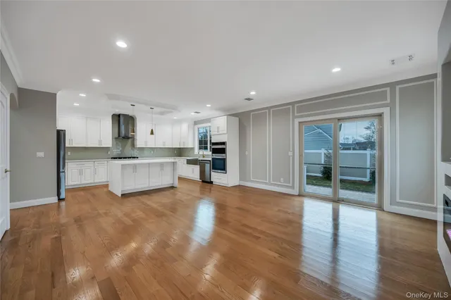 a view of a kitchen with a sink and a stove top oven