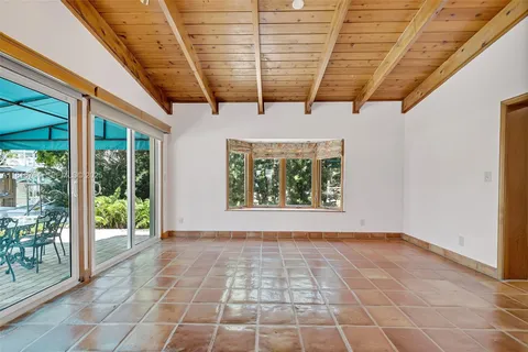 a view of an empty room with windows