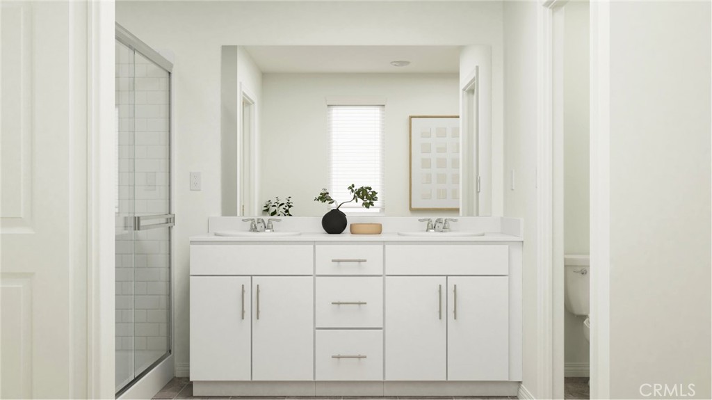 2386 Peach Tree Lane Perris, CA 92570 - Photo 17 of 23 a bathroom with a sink vanity and mirror