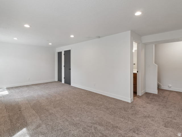130 East 7085th South, Unit 3 Midvale, UT 84047 - Photo 22 of 30 Empty room featuring light colored carpet and recessed lighting
