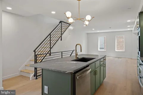 a kitchen with a stove and a sink