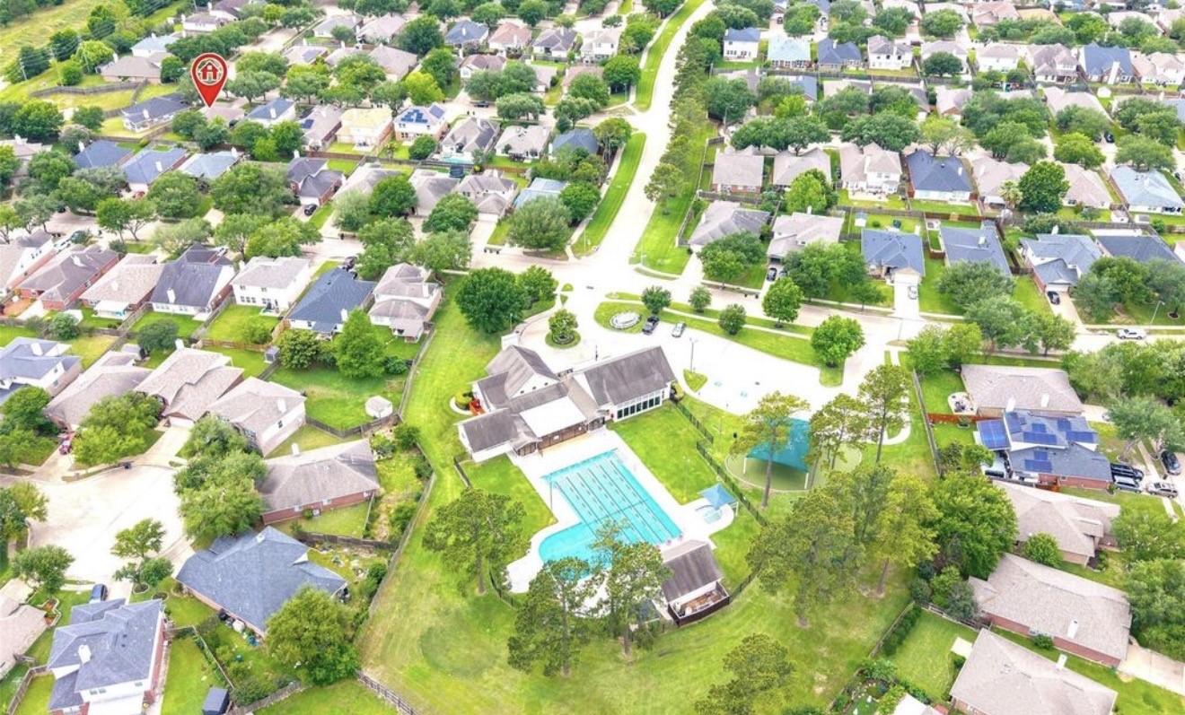 14610 Hazy Ridge Lane Cypress, TX 77429 - Photo 44 of 44 Aerial view showcasing the community's beautiful amenities, highlighting the pool, park, and recreational areas that enhance the neighborhood's exceptional lifestyle. Schedule your showing today!