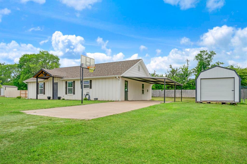 134 Private Road Paris, TX 75462 - Photo 19 of 19 a view of a house with a yard and a porch