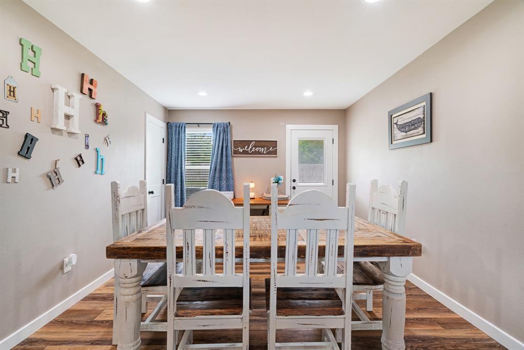 134 Private Road Paris, TX 75462 - Photo 5 of 19 a view of a dining room with furniture and wooden floor