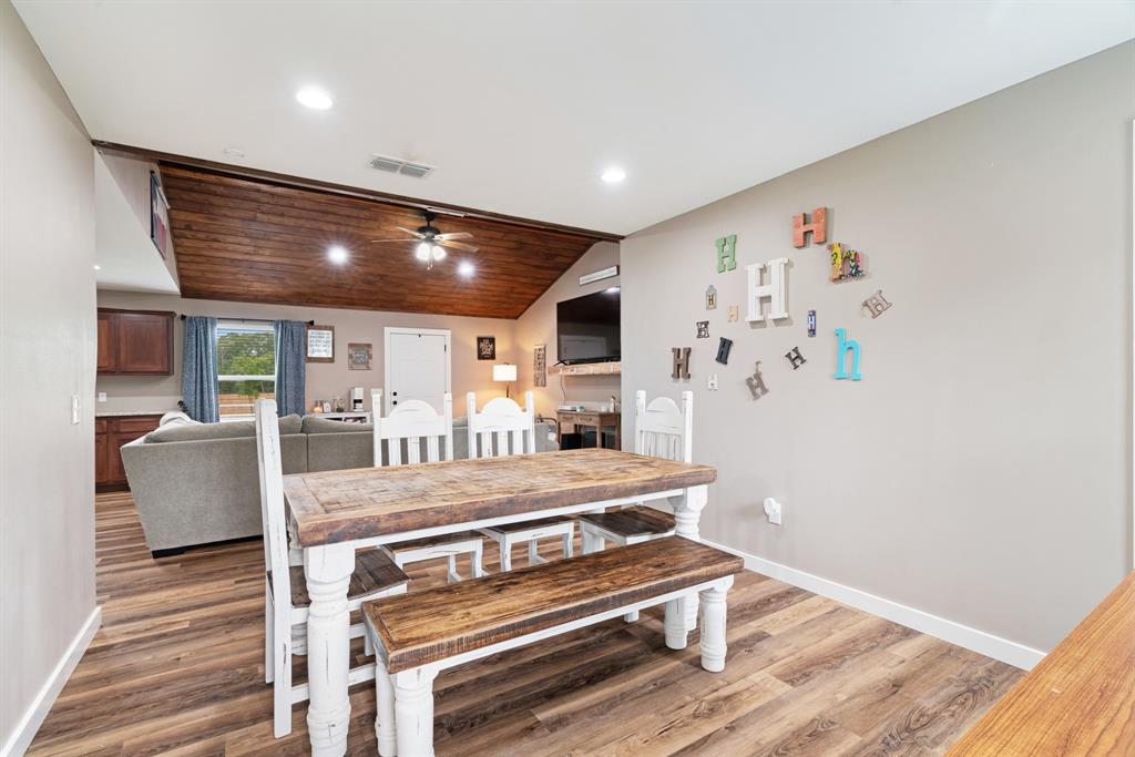 134 Private Road Paris, TX 75462 - Photo 6 of 19 a room with wooden floor table and chairs
