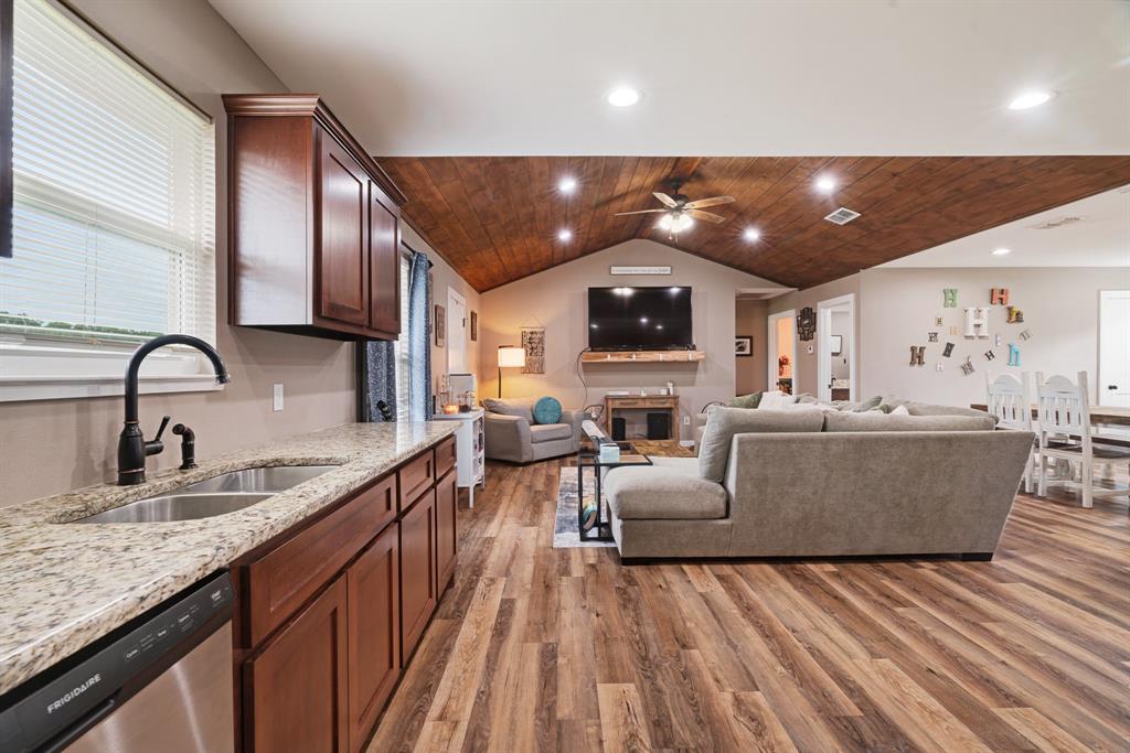 134 Private Road Paris, TX 75462 - Photo 7 of 19 a large kitchen with stainless steel appliances granite countertop a lot of counter space and wooden floors