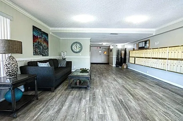 a living room with couch and a wooden floor