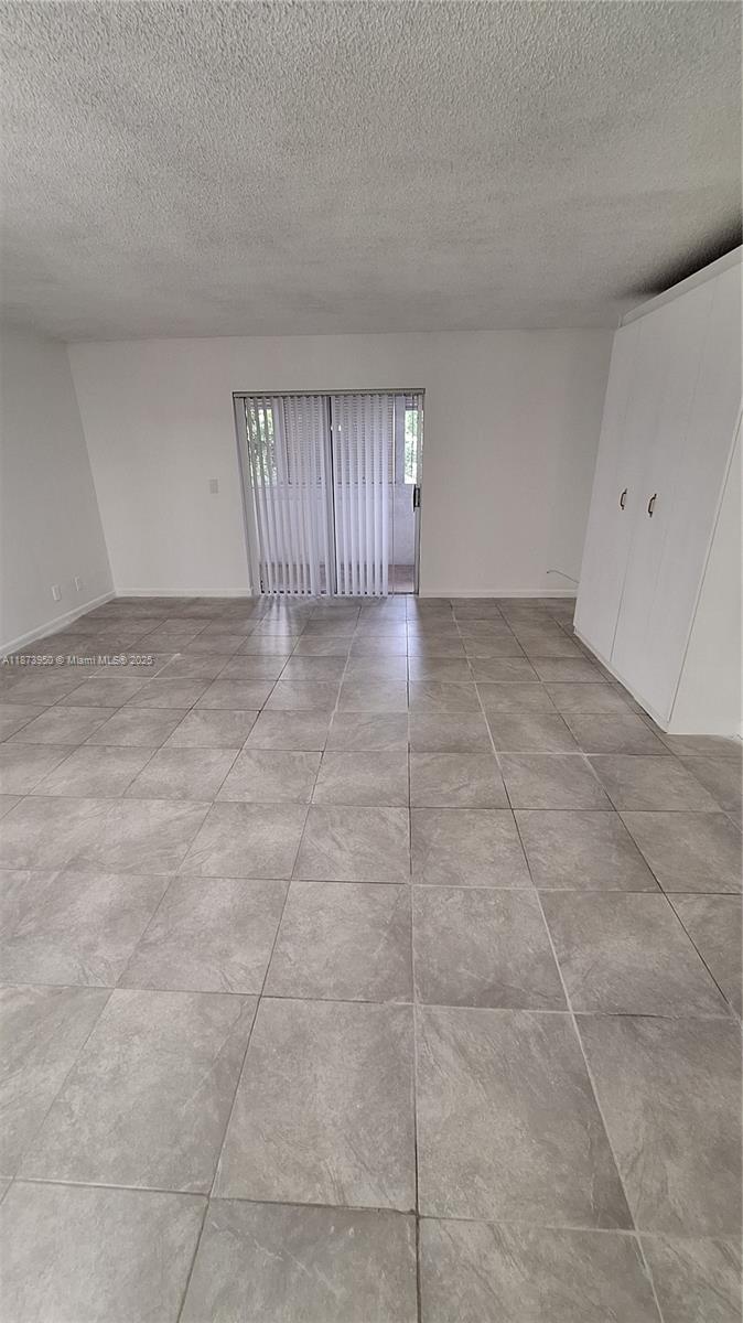 22605 Southwest 66th Avenue, Unit 409 Boca Raton, FL 33428 - Photo 3 of 19 a view of an empty room