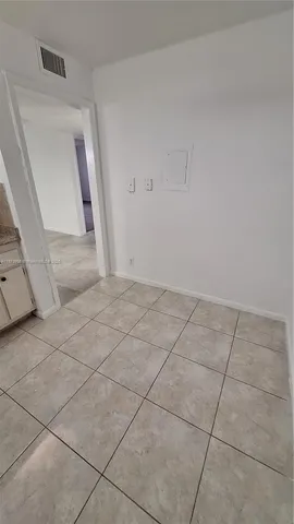a view of a livingroom with white furniture