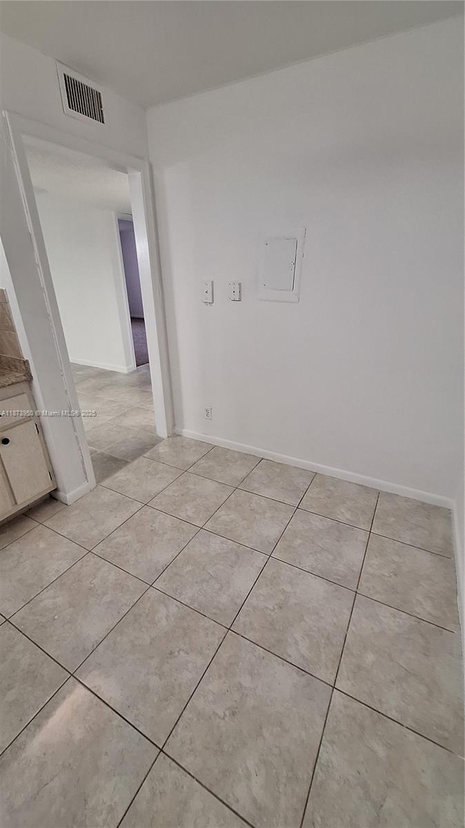 22605 Southwest 66th Avenue, Unit 409 Boca Raton, FL 33428 - Photo 8 of 19 a view of a livingroom with white furniture