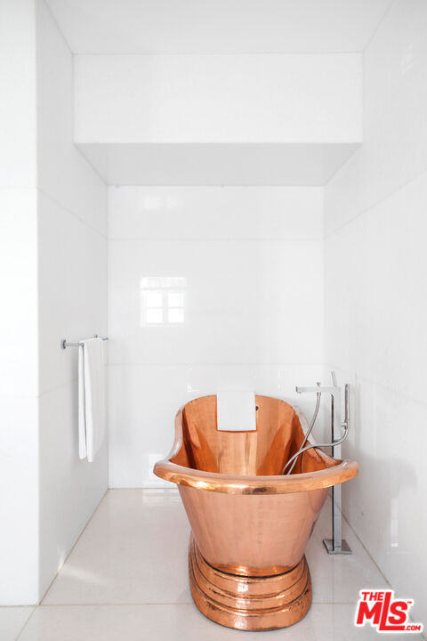 1020 Palisades Beach Road Santa Monica, CA 90403 - Photo 15 of 41 a white bath tub sitting in a bathroom