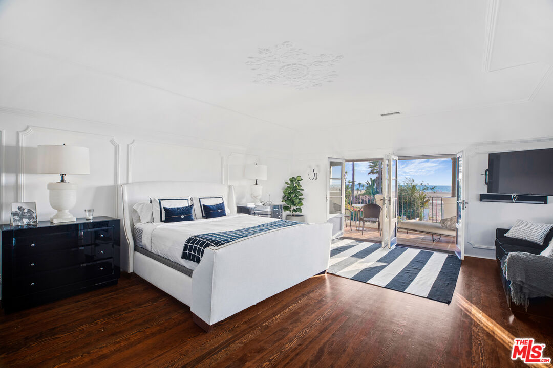 1020 Palisades Beach Road Santa Monica, CA 90403 - Photo 16 of 41 a bedroom with a large bed and a tv