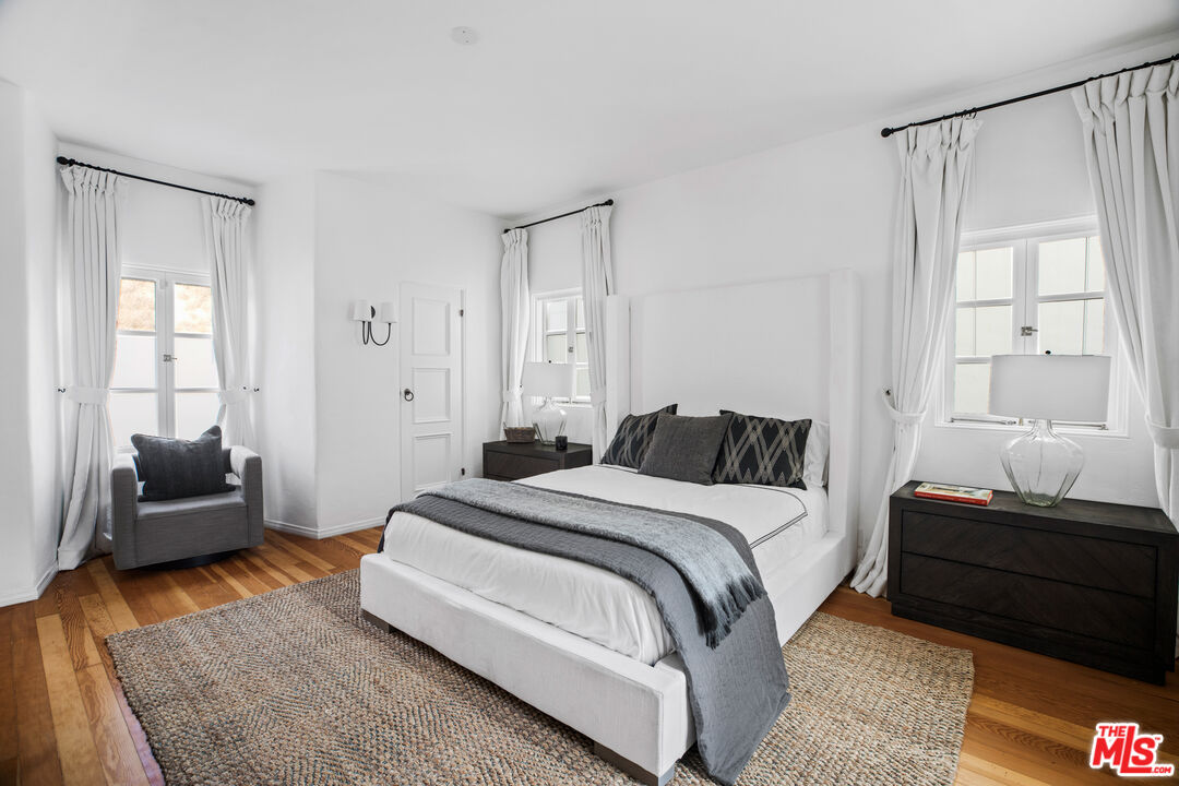 1020 Palisades Beach Road Santa Monica, CA 90403 - Photo 20 of 41 a spacious bedroom with a bed and a couch