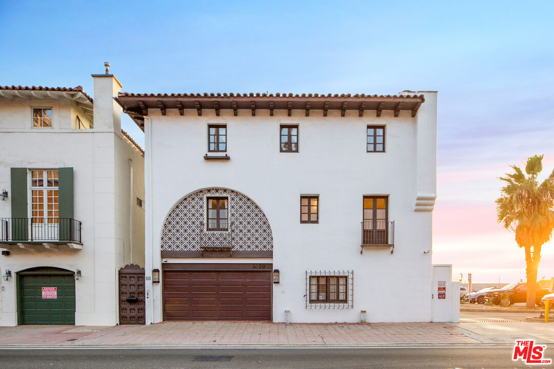 1020 Palisades Beach Road Santa Monica, CA 90403 - Photo 2 of 41 a front view of a house with garage