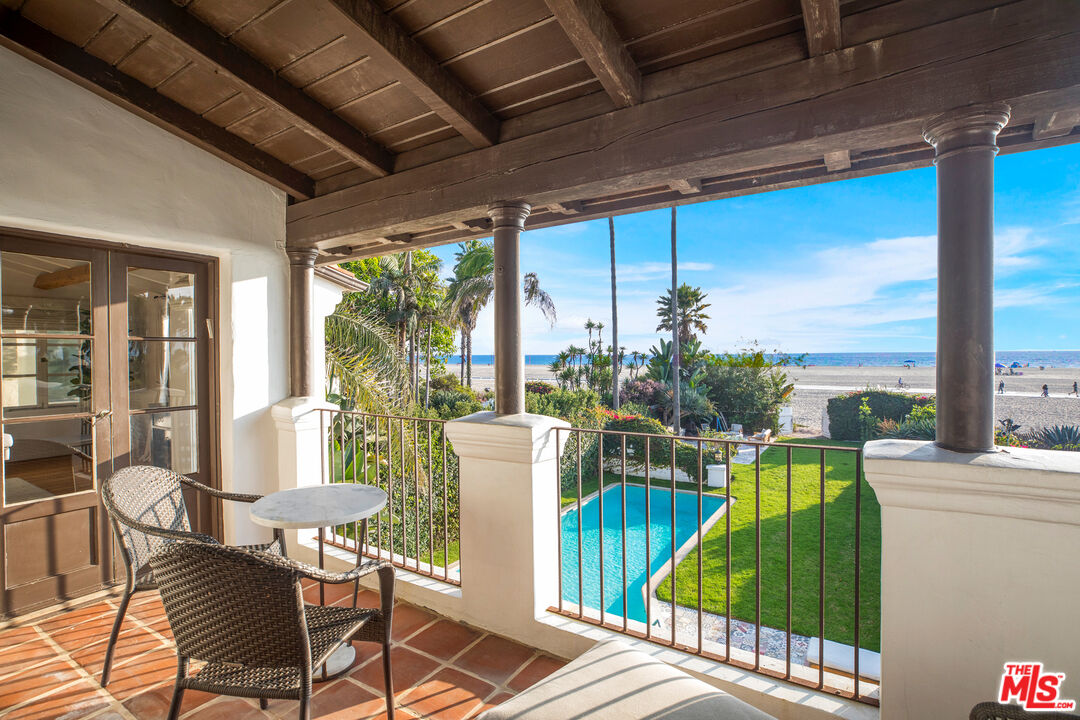 1020 Palisades Beach Road Santa Monica, CA 90403 - Photo 28 of 41 a view of a chairs and table in patio with a garden view