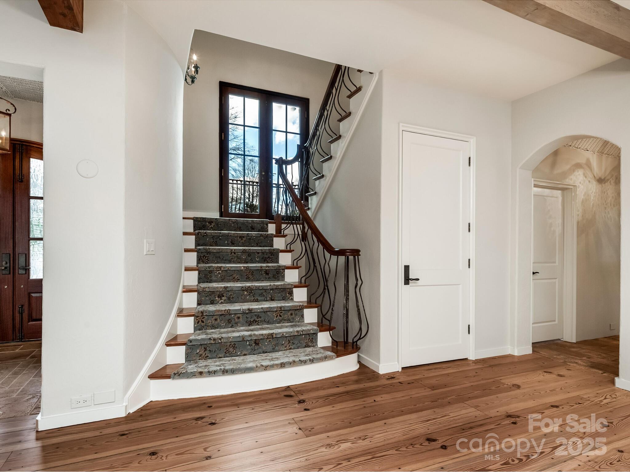 8525 Double Eagle Gate Way, Unit 2 Charlotte, NC 28210 - Photo 11 of 48 a view of entryway and hall with wooden floor