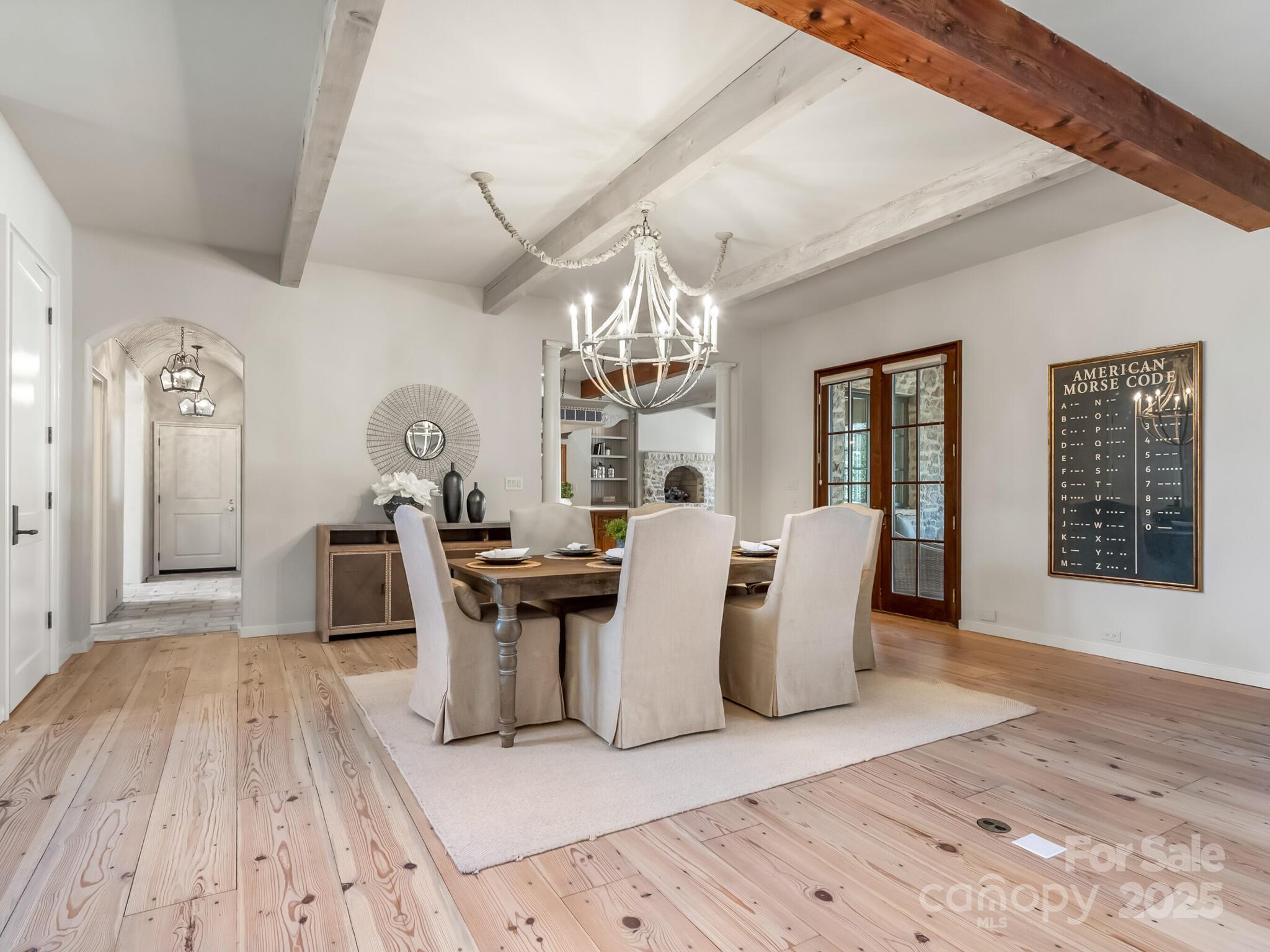 8525 Double Eagle Gate Way, Unit 2 Charlotte, NC 28210 - Photo 13 of 48 a dining room with furniture and wooden floor