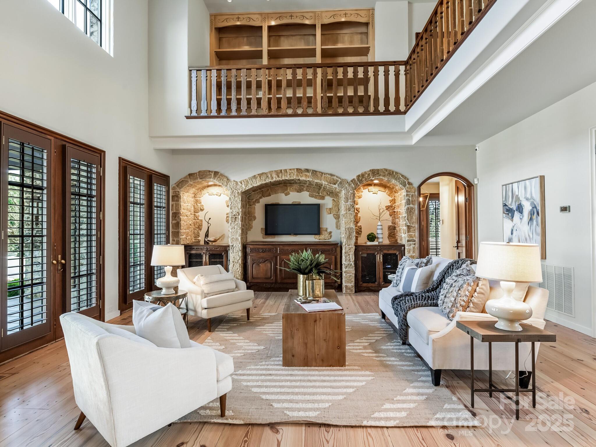 8525 Double Eagle Gate Way, Unit 2 Charlotte, NC 28210 - Photo 15 of 48 a living room with fireplace furniture and a large window