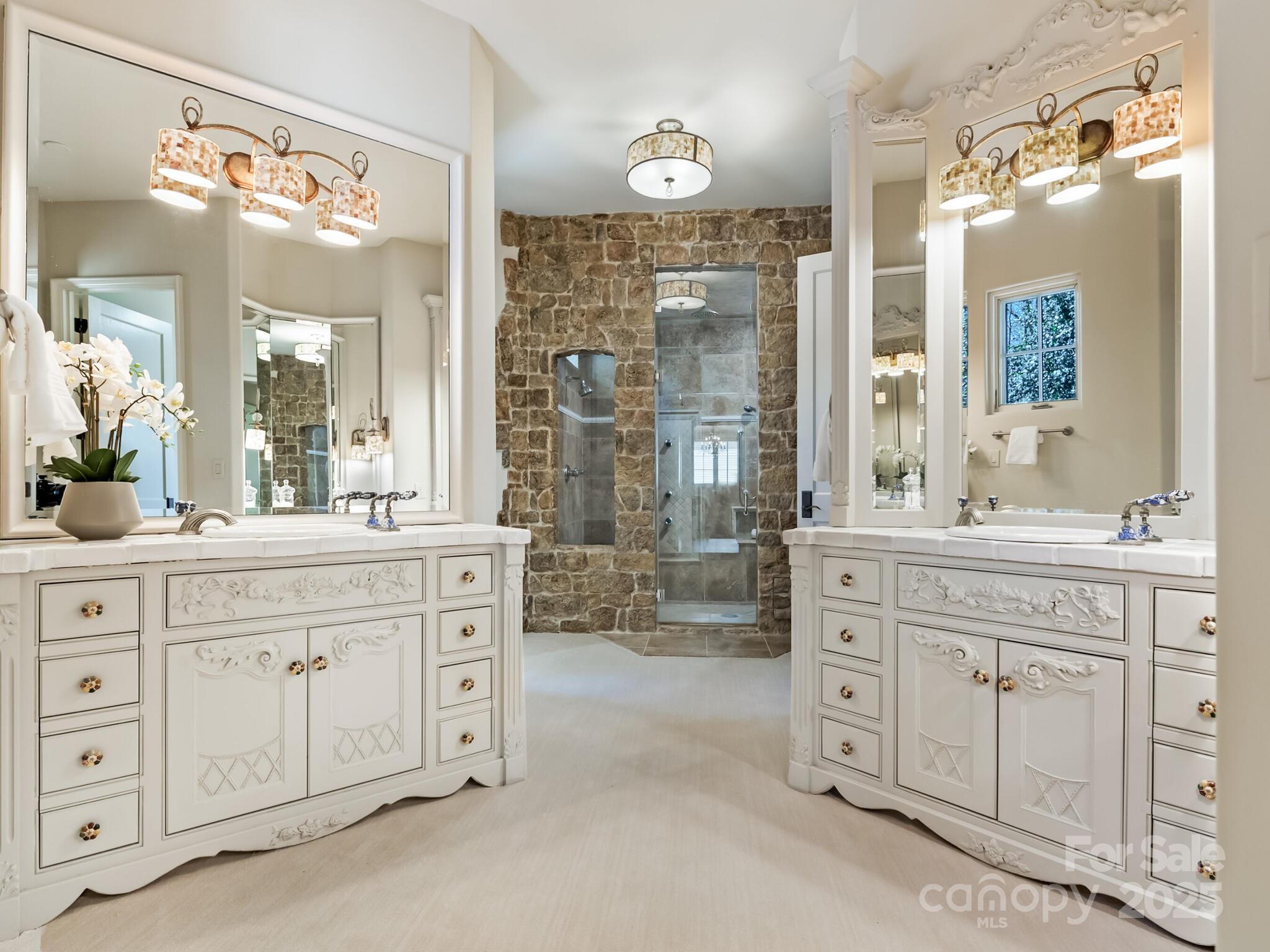 8525 Double Eagle Gate Way, Unit 2 Charlotte, NC 28210 - Photo 21 of 48 a spacious bathroom with a granite countertop sink mirror and a