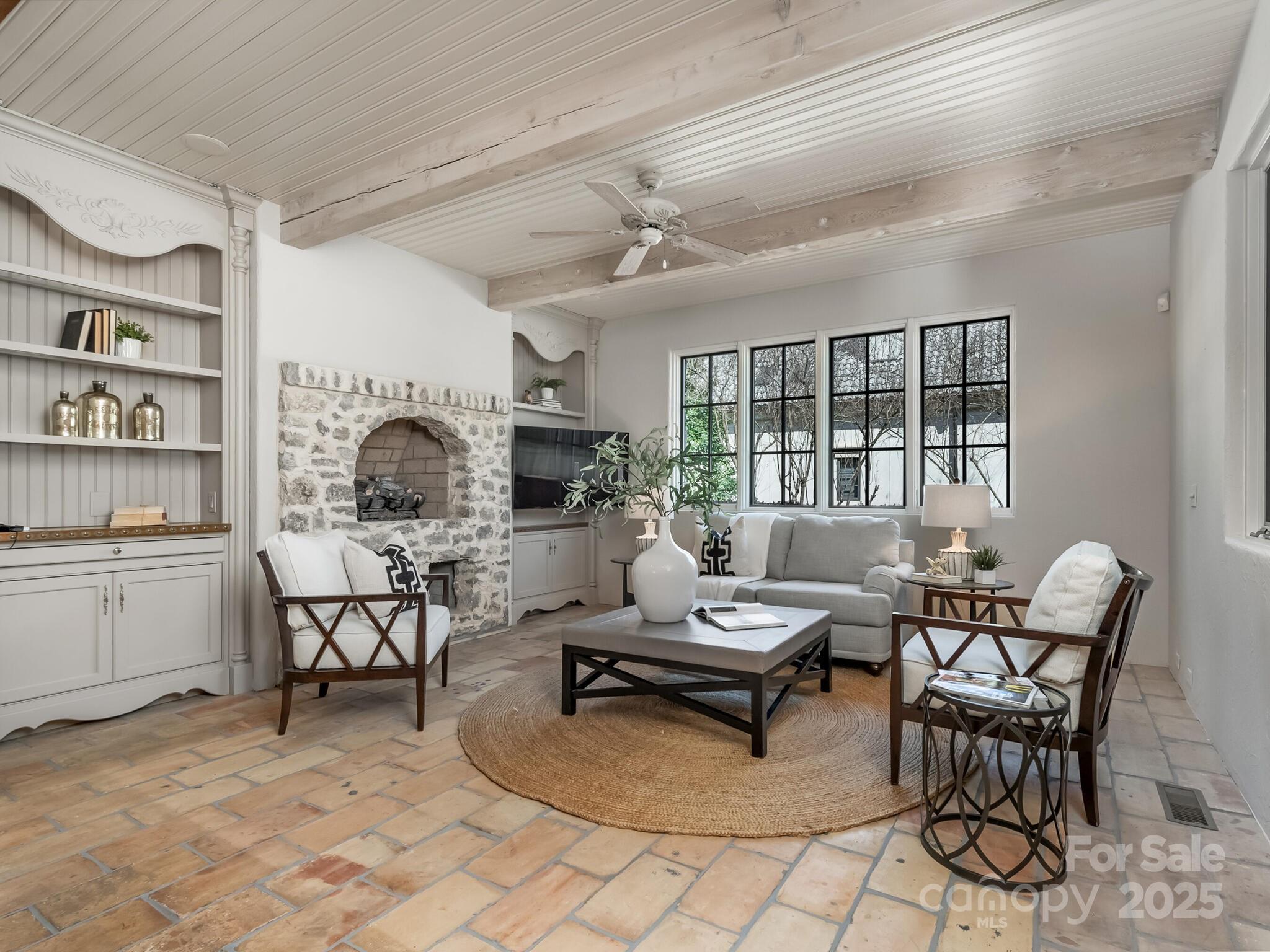 8525 Double Eagle Gate Way, Unit 2 Charlotte, NC 28210 - Photo 9 of 48 a living room with furniture and a fireplace