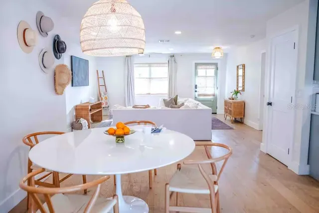 a dining room with furniture and window